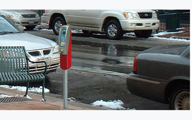 Single-space credit-card-capable parking meter on a winter street