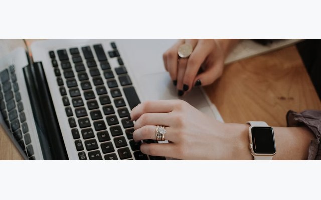 Motorist reviewing parking violation images online on a laptop